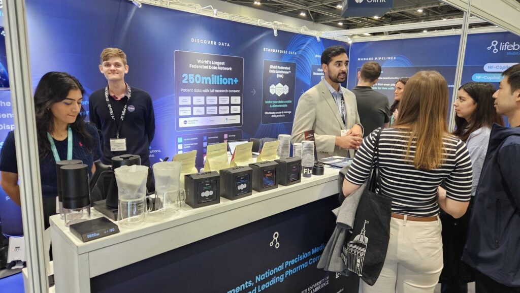 Visitors talking with the team at the Lifebit booth