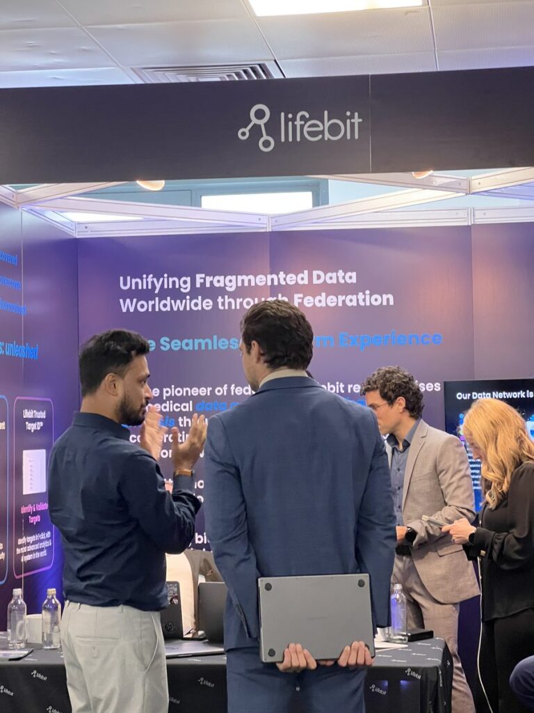 Conversations under the Lifebit sign at the Research Summit