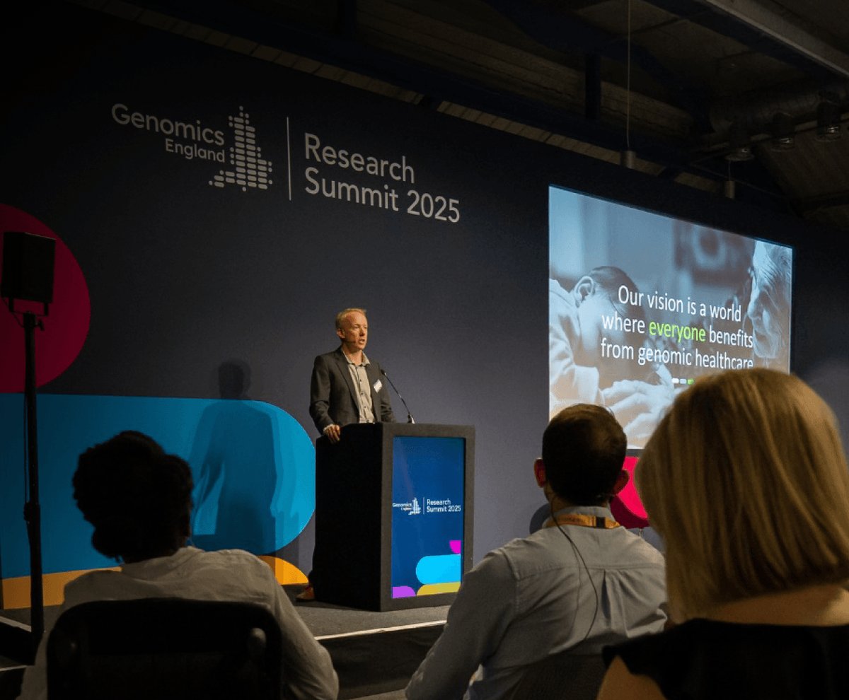 A speaker on stage at the Genomics England Research Summit 2025